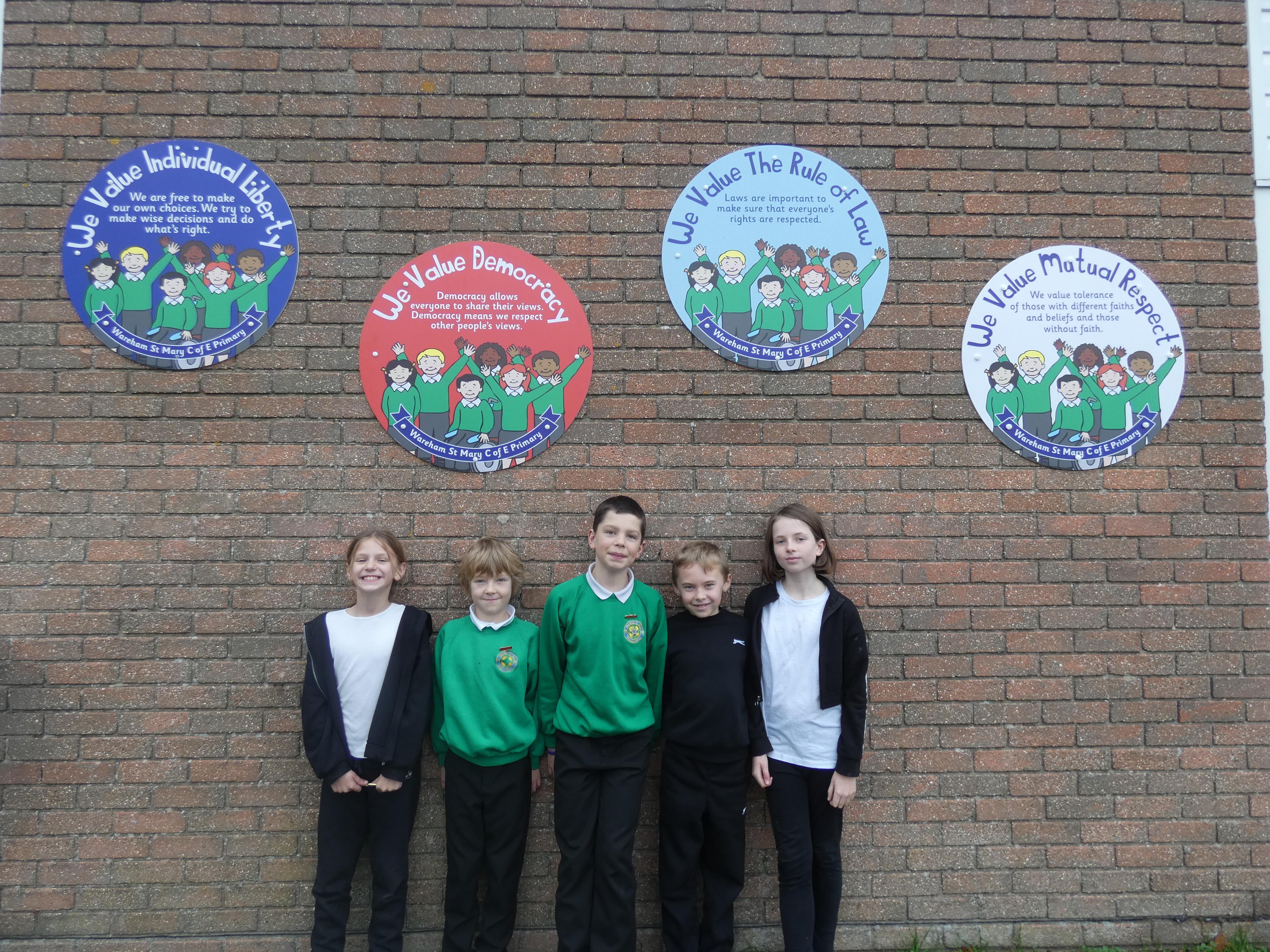 Our School Council members under our British Values display.